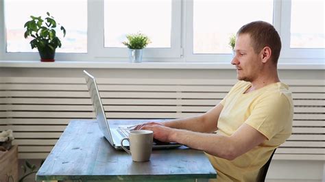 Man Freelancer Working Remotely At Home On Laptop Stock Video Footage