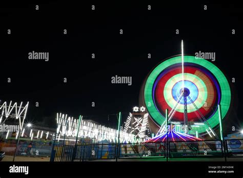 Long Exposure Slow Shutter Speed Shot Of A Spinning Ferris Wheel With