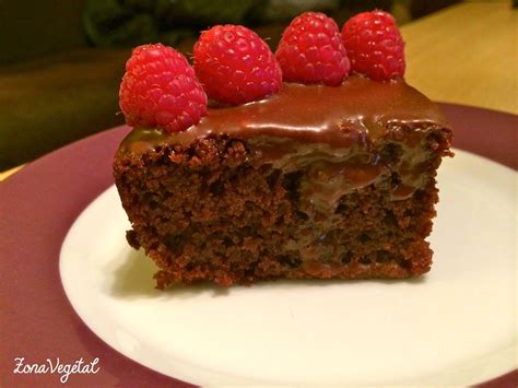 A Piece Of Chocolate Cake With Raspberries On Top