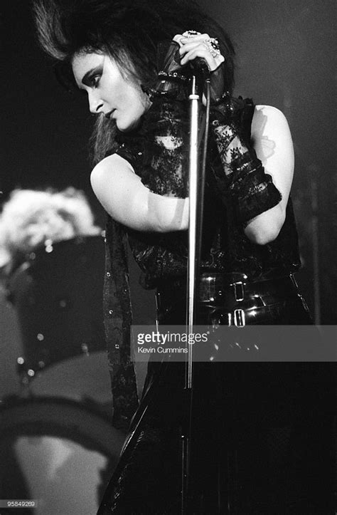 siouxsie sioux performs on stage with siouxsie and the banshees at the apollo in manchester