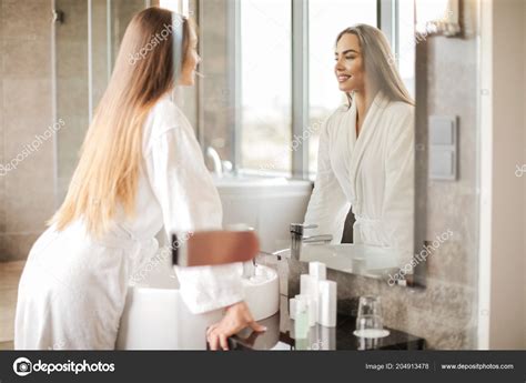 Young Beautiful Woman Looking Mirror Bathroom Stock Photo By ©olly18