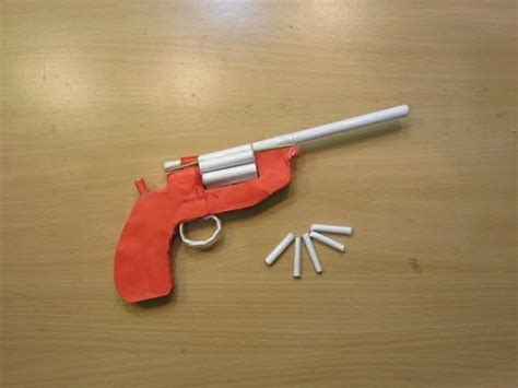 To make the handle of the paper gun, use the second strip of paper to line up with the centre crease. How to make a Paper Revolver that Shoots Paper Bullet ...