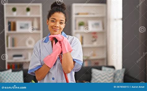 African American Woman Clean Professional Holding Mop Smiling At Home