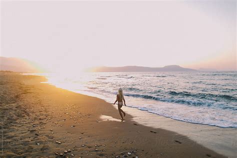Babe Naked Girl Running Along The Beach At Sunset By Stocksy Contributor Evgenij Yulkin