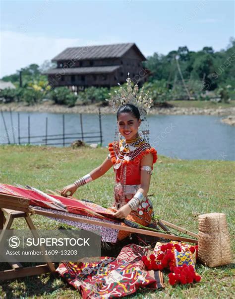 Sarawak Cultural Village Iban Women Dressed In Traditional Costume Doing Traditional Wea