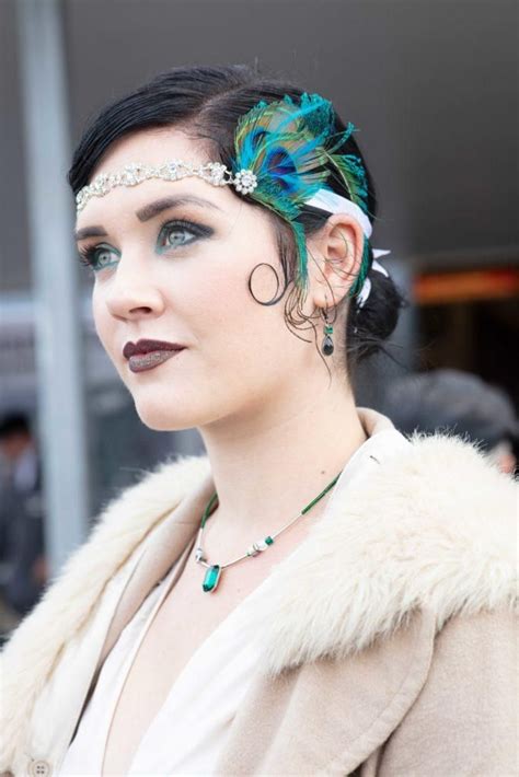 flapper hairstyles for long hair woman at goodwood revival with dark brown hair in a low bun