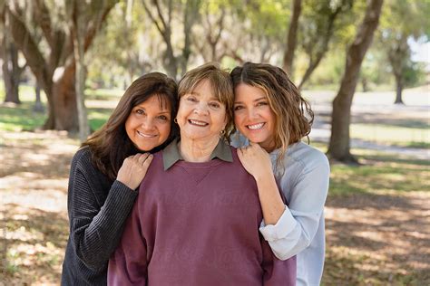 Three Generations Of Related Women Together Smiling By Stocksy