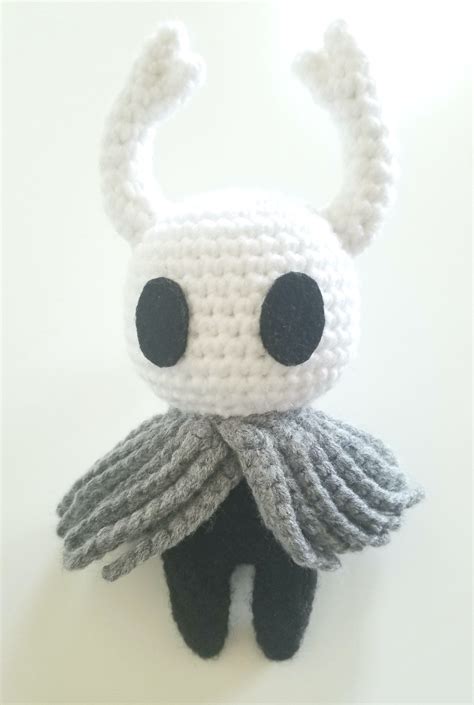 I crocheted the main character from my favorite game Hollow Knight #