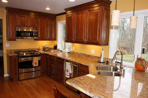 The cherry kitchen cabinets and granite countertop are easy to clean and maintain their lustrous looks so that the kitchen sustains a welcoming and homely feel. The Best Color Granite for Cherry Cabinets and Hardwood ...