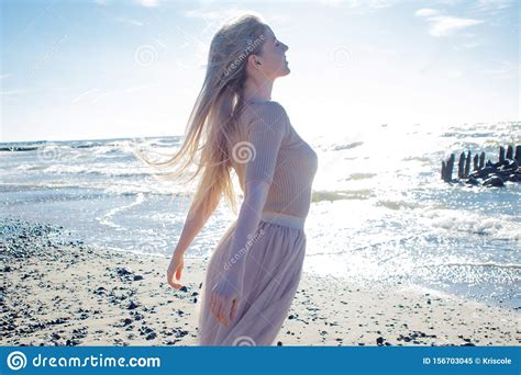 Young Cheerful Girl On The Seashore Young Blonde Woman Smiling Stock
