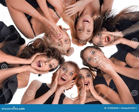 Group Of Happy Amazed Women Surprized And Looking Down Stock Photo