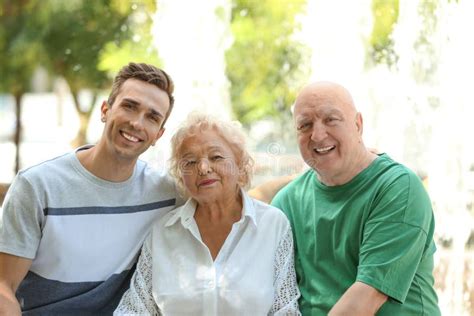 Man With Elderly Parents Outdoors Stock Image Image Of Rest Father