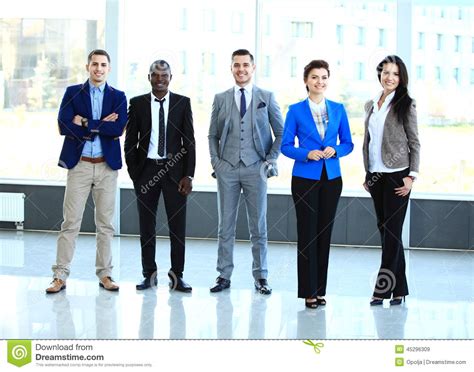 Professional Business Team Looking Confidently At Camera Stock Image