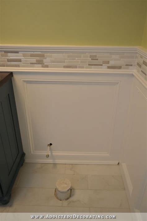 Tiles can mimic the look of natural featuring a white subway tile with wainscoting design this master bathroom features a freestanding tub, plantation shutters and gray wall paint. Finished Recessed Panel Wainscoting (Judges Paneling) With ...