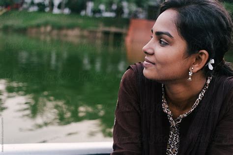 Portrait Of Young Bengali Woman At Park By Jessica Lia Stocksy United