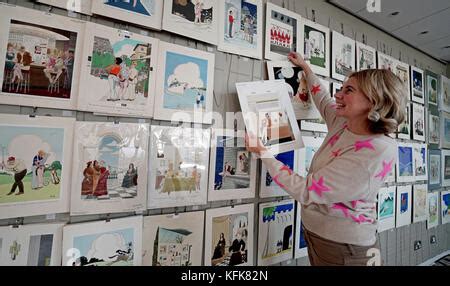 Auctioneer Catherine Southon Holds Examples From The Smilby Cartoon