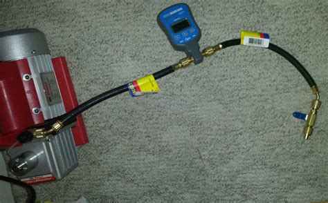 The best vacuum is 300 micron. Hook up micron gauge vacuum pump.