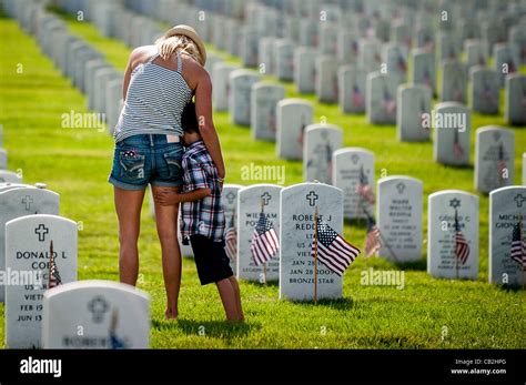May 24, 2012 - Arlington, Virginia, U.S. - A mother stands with her son