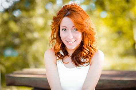 Premium Photo The Red Haired Girl Smiles Sweetly Laughs Back Real Emotions A Pretty Woman