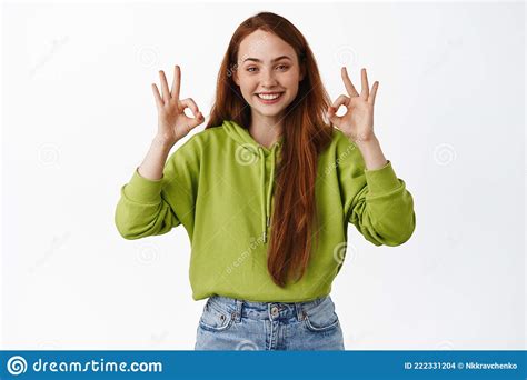 Perfect Smiling Pleased Redhead Girl Shows Okay Ok Sign Nod In