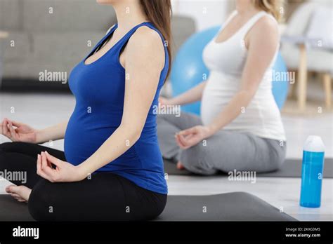 Pregnant Women Meditating During Antenatal Yoga Class Stock Photo Alamy