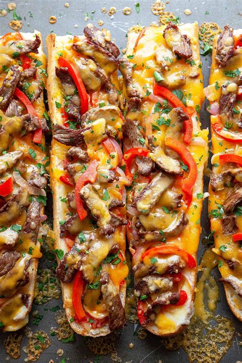 Philly cheese steak cheesy bread seems like a complicated recipe, but in less than 20 minutes it is really ready to go in the oven and is a great recipe for a crowd. Cheesy Philly Cheesesteak Bread | Foodtasia