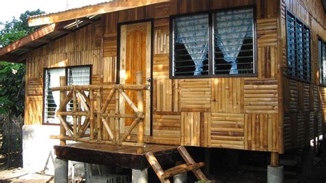 A House Made Out Of Wood With Windows And Shutters