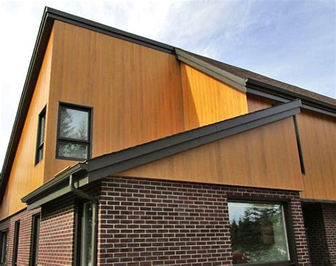 Included in the mix are some board and batten metal panels, brick and a few different types of horizontal lap siding. Dizal Wood Aluminum Siding | Modern Materials