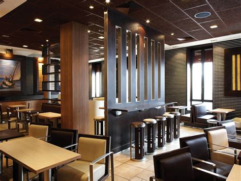 A suspended ceiling is installed beneath the original ceiling of a room; Potter Interior Systems Offers Acoustic Ceiling Range - EBOSS