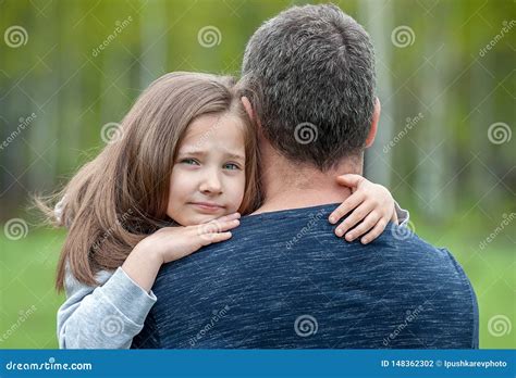 Portrait Of One Sad Daughter Hugging Her Father Stock Photo Image Of