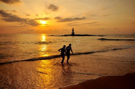 Silhouette Romantic Scene Of Couples On The Beach Stock Image Image