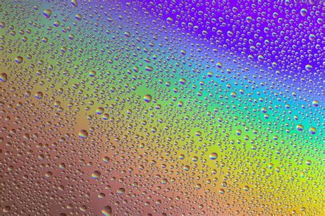 Drops Of Water On The Glass With The Reflection Of The Rainbow Stock