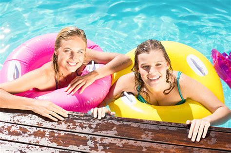 Happy Friends Enjoying In The Swimming Pool Stock Photo - Download Image Now - iStock