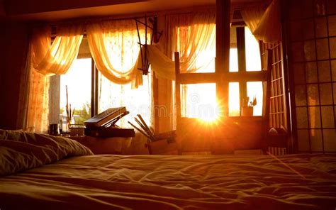 View Of Sun Rising Through An Artist S Bedroom Studio Window Stock
