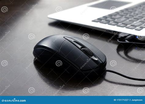 Computer Mouse And Laptop Computer Keyboard On A Wooden Table Stock