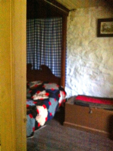 Irish Cottage Traditional Interior With Quilt And Drapes Seen At
