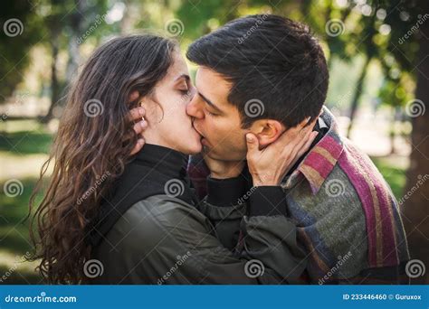 Close Up Of French Kiss Couple In Love Hugging And Kissing Stock Photo