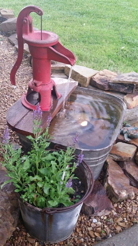 Use a selection of floaters. Galvanized metal wash tub and water pump turned in to a ...