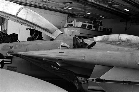 A Plane Captain Relaxes On The Wing Of A Fighter Squadron 143 Vf 143
