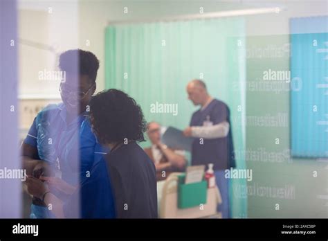 Female Doctor And Nurse Talking In Hospital Room Stock Photo Alamy