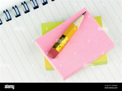 Short Pencil With Gummed Labels An Notepad Stock Photo Alamy