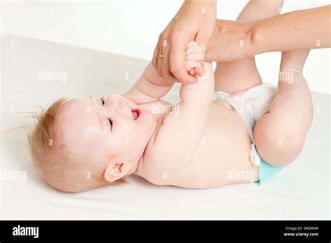 Mother Massaging Her Baby Girl Stock Photo Alamy