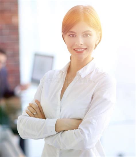 Portrait Of Young Business Woman On The Background Of The Office Stock