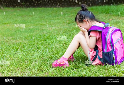 Stress Girl Sitting And Thinking On The Grass Stock Photo Alamy
