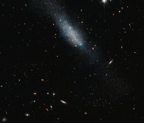 Edwin hubble invented a classification of galaxies and grouped them into four classes: Hubble Views Irregular Galaxy 149-3