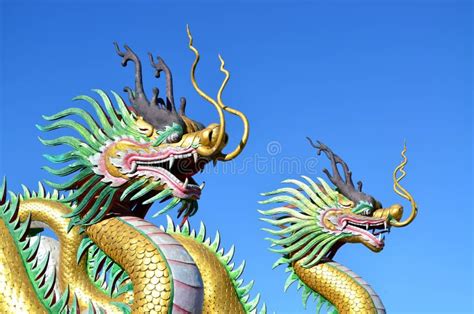 Multicolor Of Two Chinese Dragon Statues Against Blue Sky Stock Image