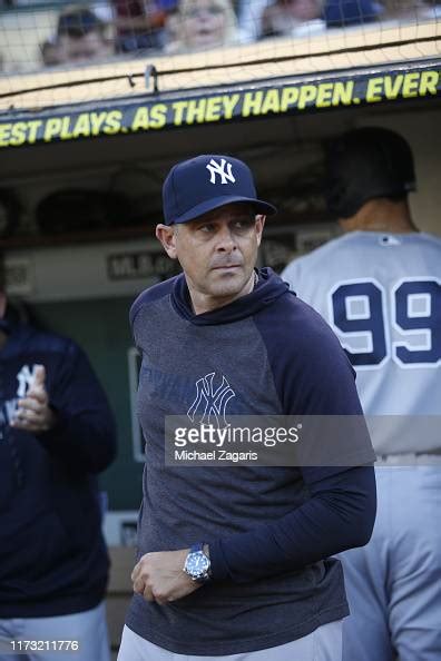 Manager Aaron Boone Of The New York Yankees Stands In The Dugout