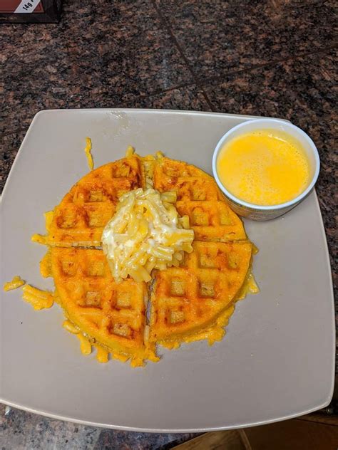 Mac And Cheese Waffle Topped With Mac And Cheese And Served Queso