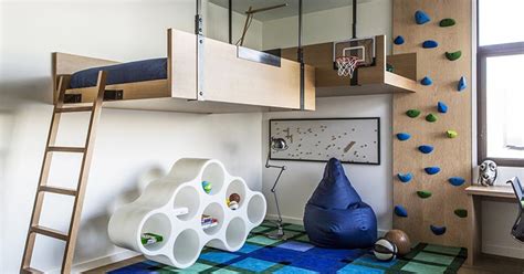 A Fun Kids Bedroom With A Loft Bed And Rock Climbing Wall