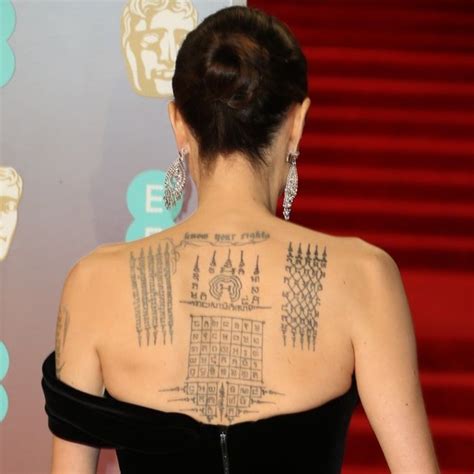Angelina Jolie Showing Off Her Protection Tattoos Done By A Thai Monk To Symbolically B